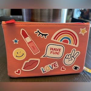 Ipsy Glambag in Orange with makeup images & a Rainbow Zipper, NEW Never Used